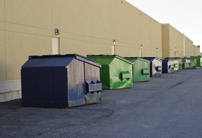 large construction waste containers in a row at a job site in Allendale